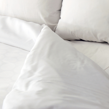 White bed, pillow, duvet