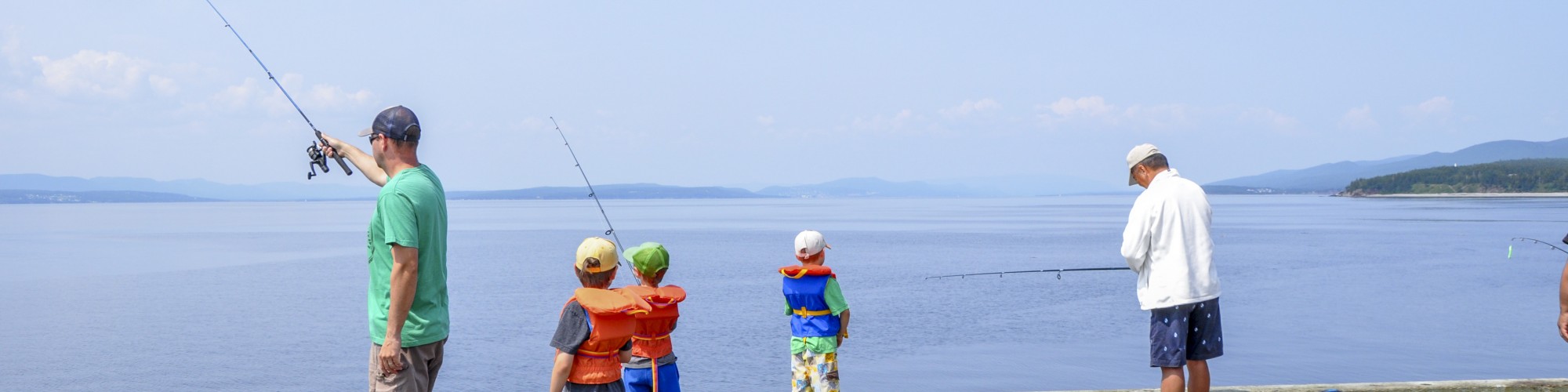 Person fishing, on a dock