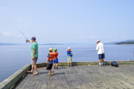 Person fishing, on a dock