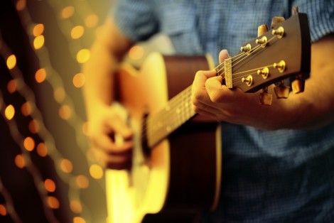 Man playing guitar, event, evening