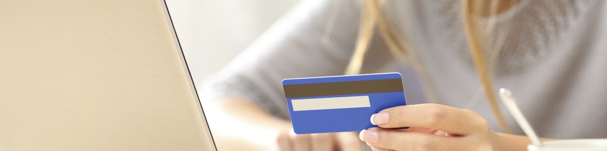 Woman paying online with her laptop